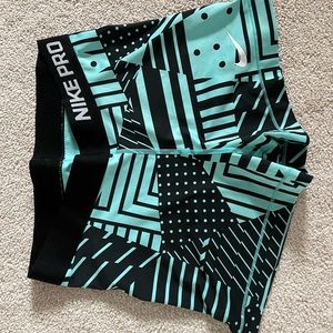 Nike Pros size small blue and black aztec pattern